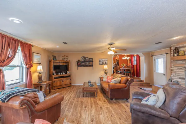 a bathroom with a toilet and a shower curtain