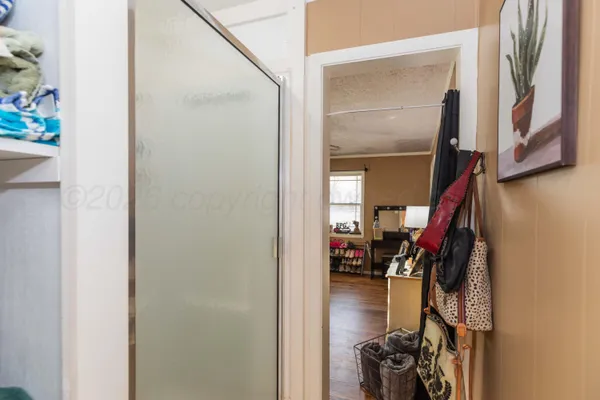 a bathroom with a tub and shower