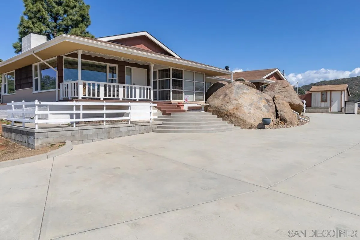 a front view of a house with a porch