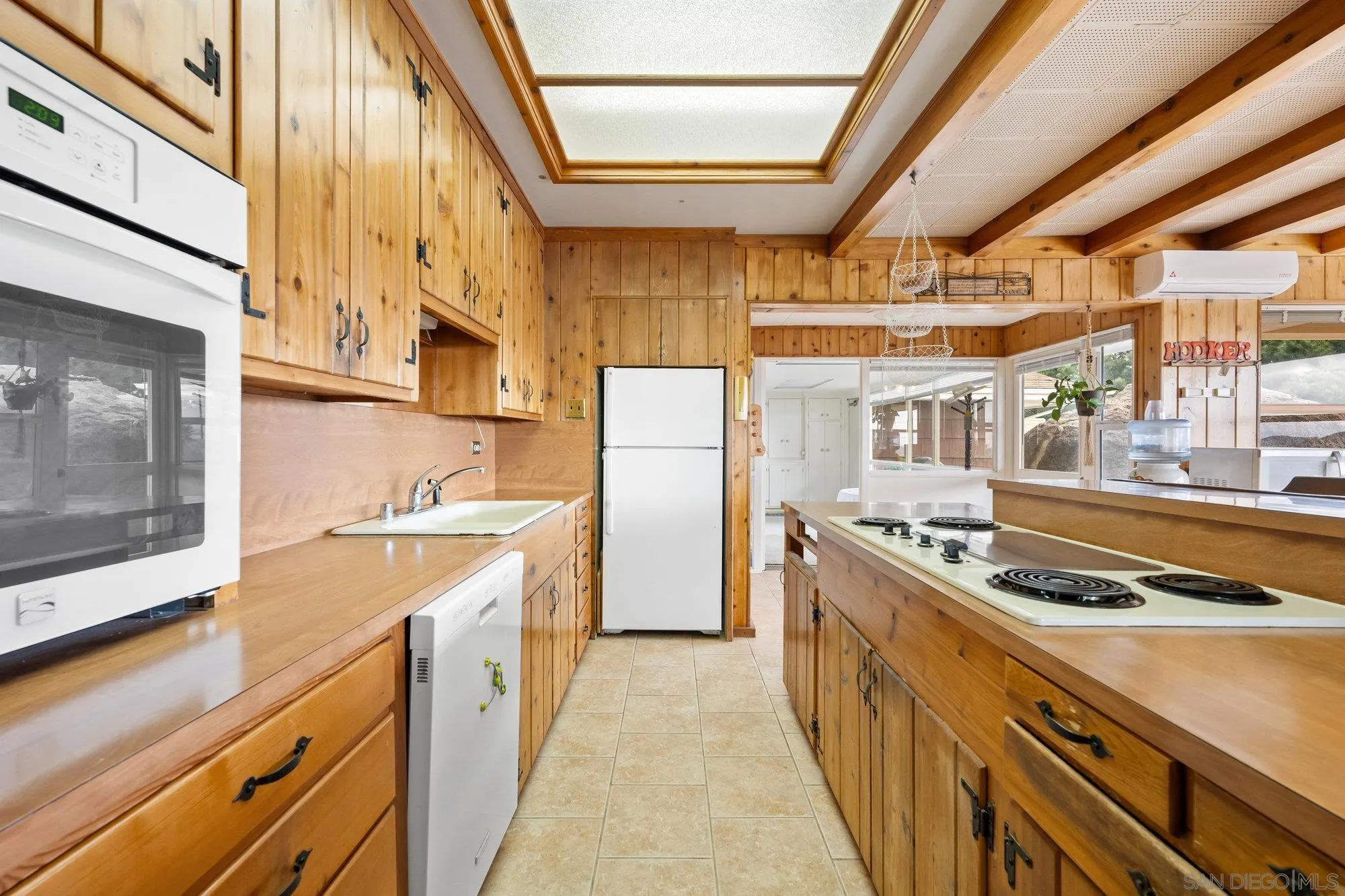 10407 Hawley Road El Cajon, CA 92021 - Photo 11 of 40 a kitchen with stainless steel appliances granite countertop a stove and a refrigerator