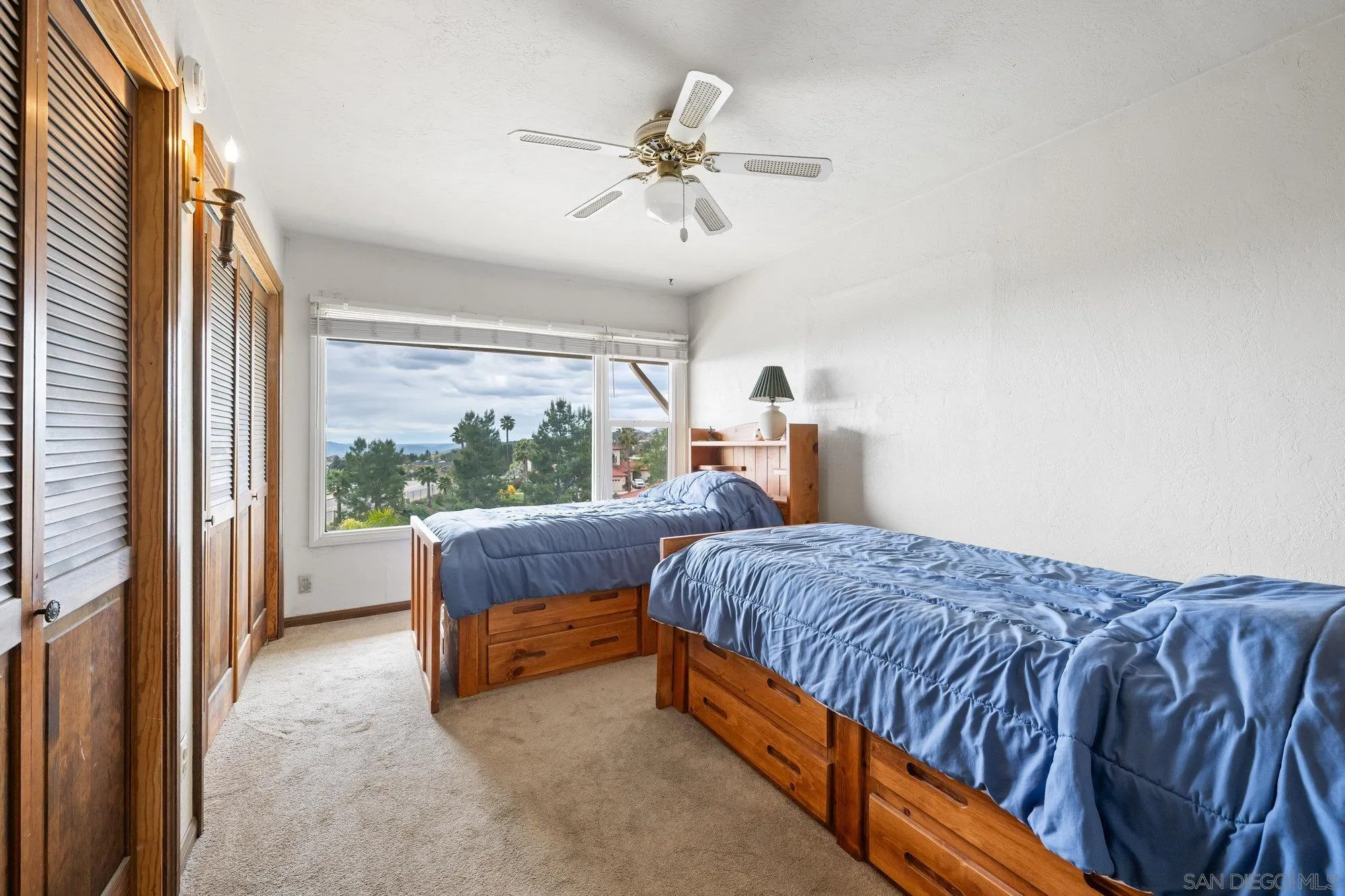 10407 Hawley Road El Cajon, CA 92021 - Photo 14 of 40 a bedroom with a bed and a large window