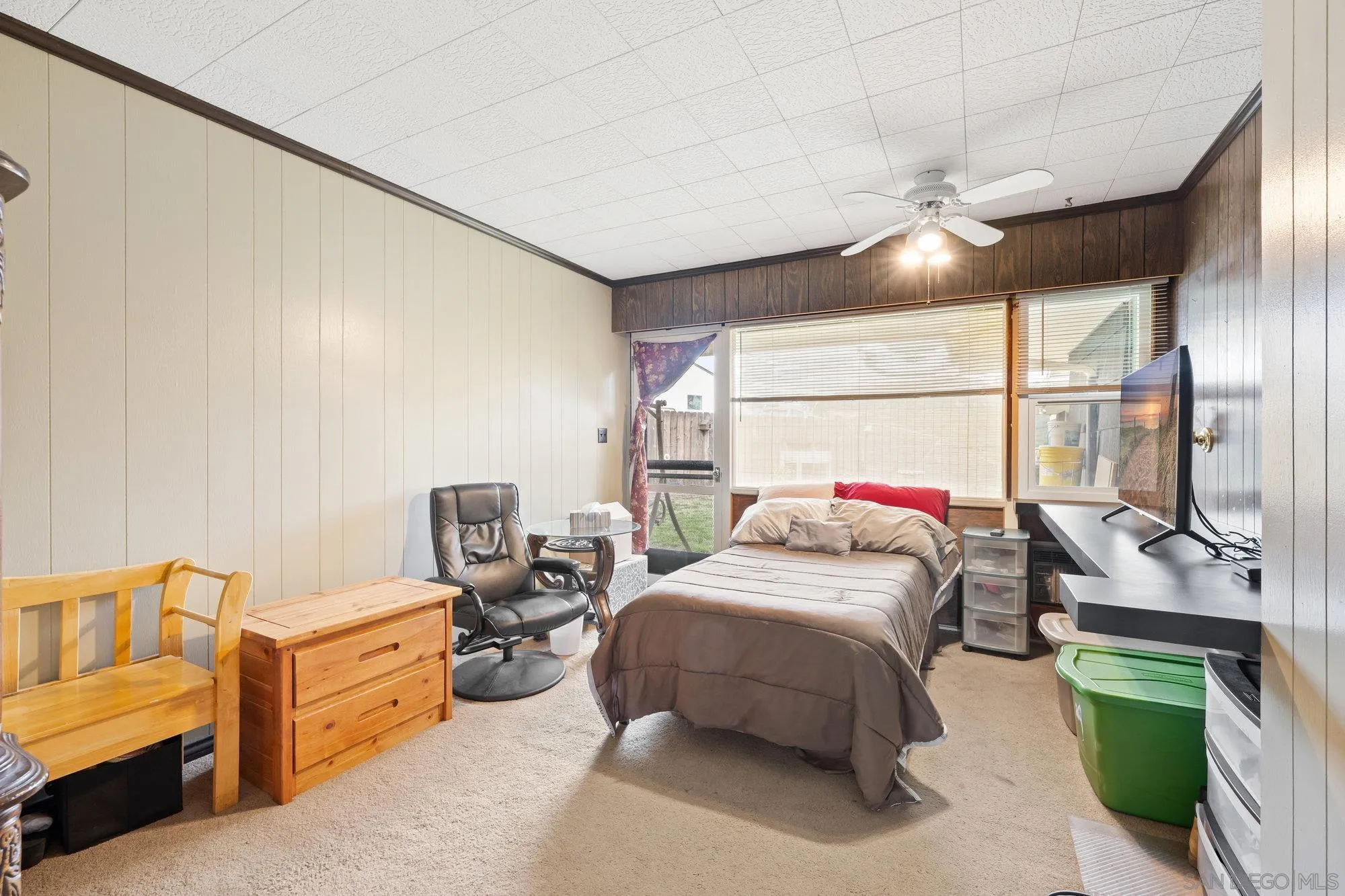 10407 Hawley Road El Cajon, CA 92021 - Photo 15 of 40 a bedroom with a bed and a chandelier