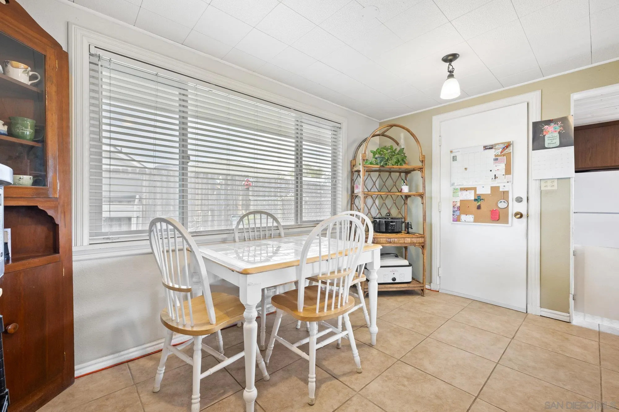 10407 Hawley Road El Cajon, CA 92021 - Photo 18 of 40 a view of a dining room with furniture window and outside view