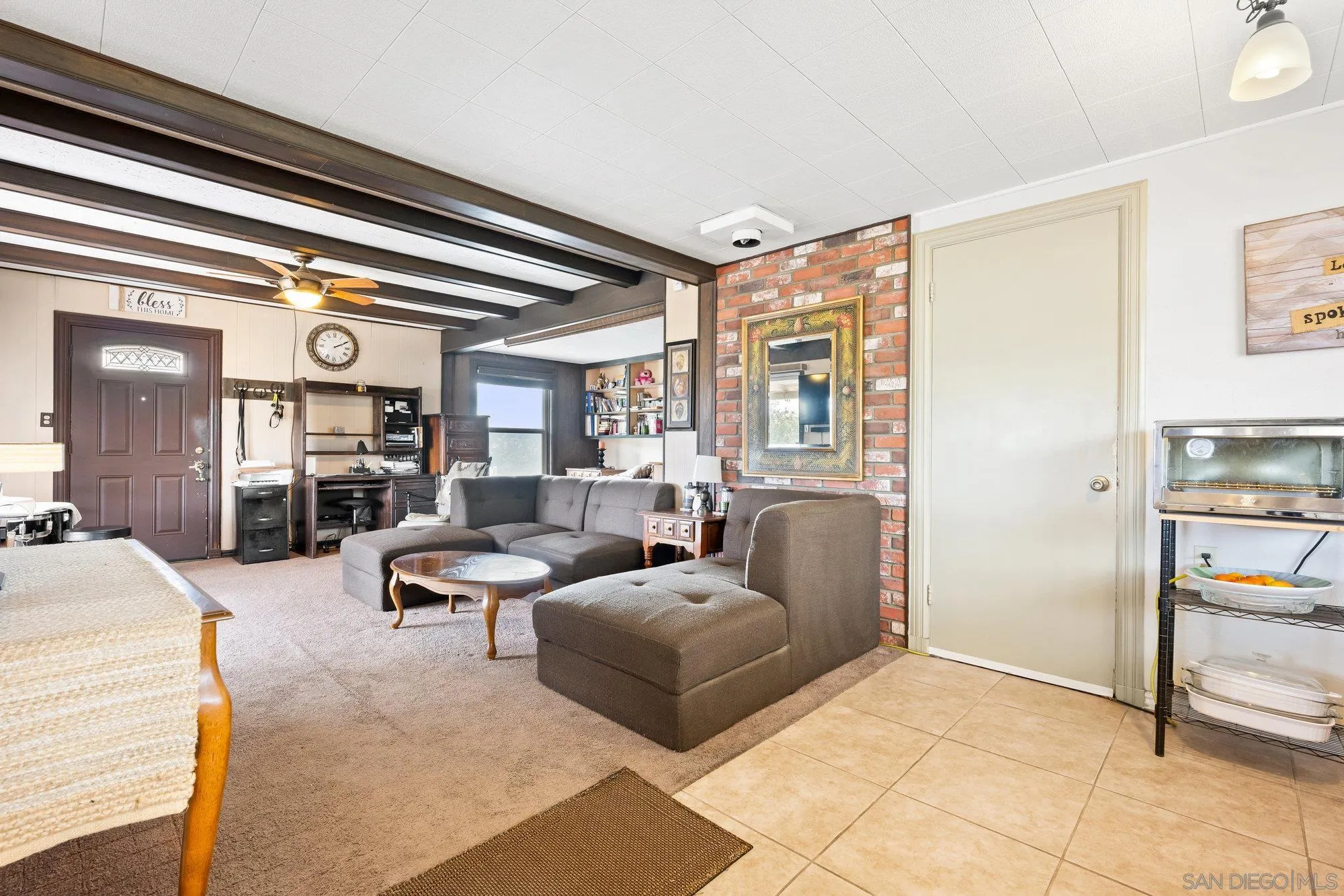 10407 Hawley Road El Cajon, CA 92021 - Photo 19 of 40 a living room with furniture and a large window
