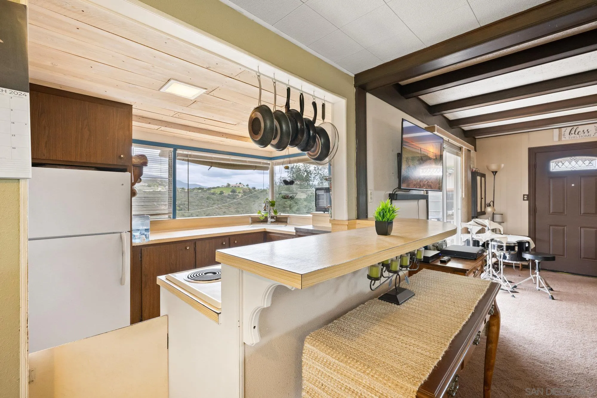 10407 Hawley Road El Cajon, CA 92021 - Photo 20 of 40 a kitchen with a sink and a refrigerator