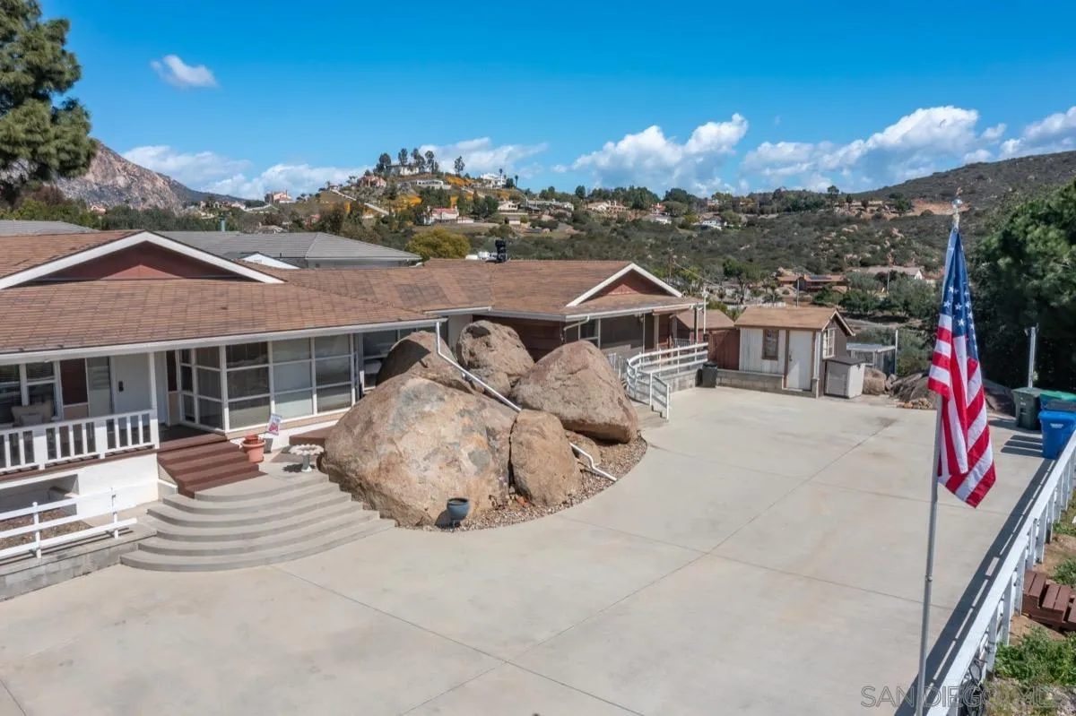 10407 Hawley Road El Cajon, CA 92021 - Photo 36 of 40 a view of a white house with a table and chairs