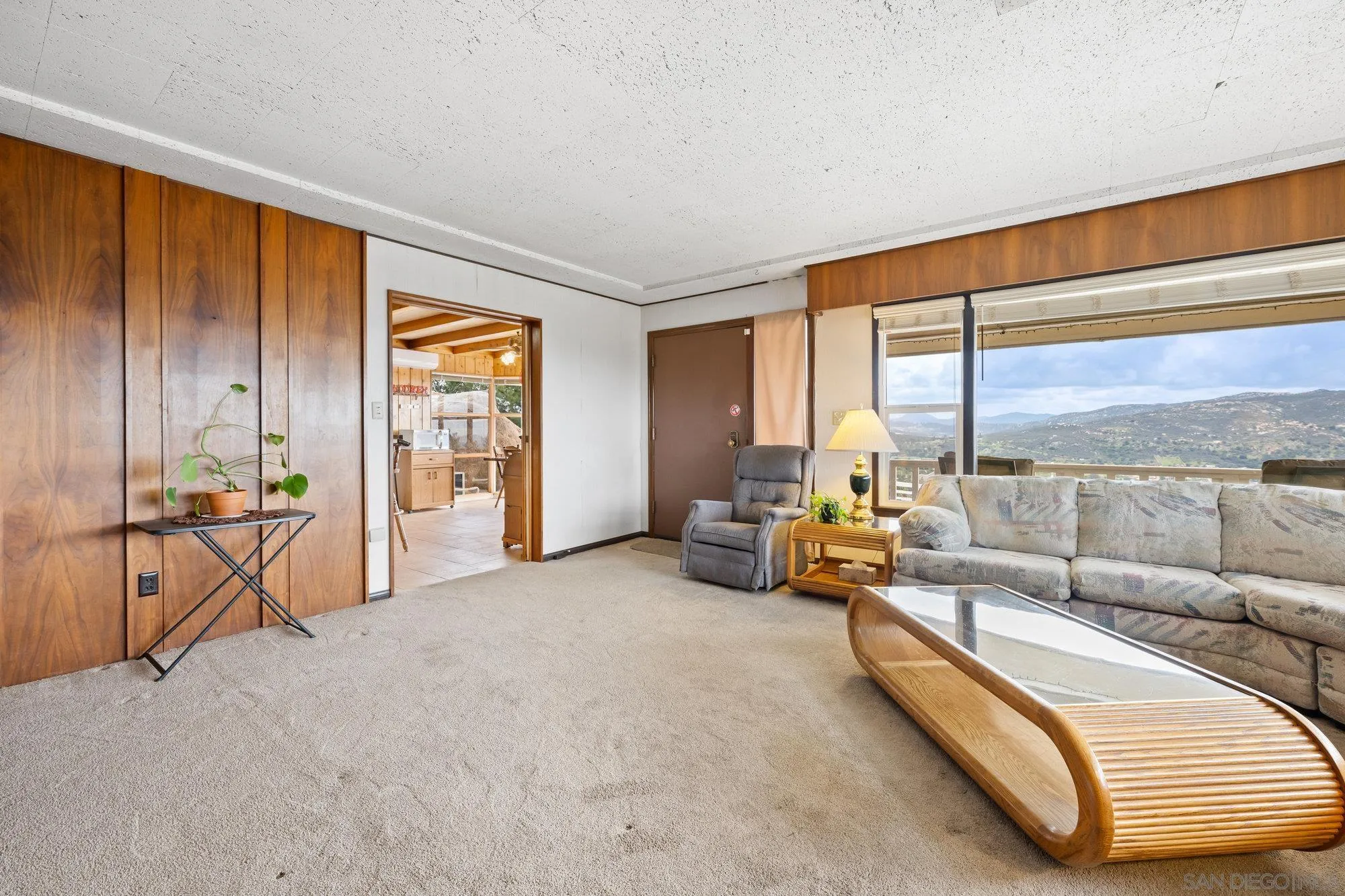 10407 Hawley Road El Cajon, CA 92021 - Photo 5 of 40 a living room with furniture and large windows
