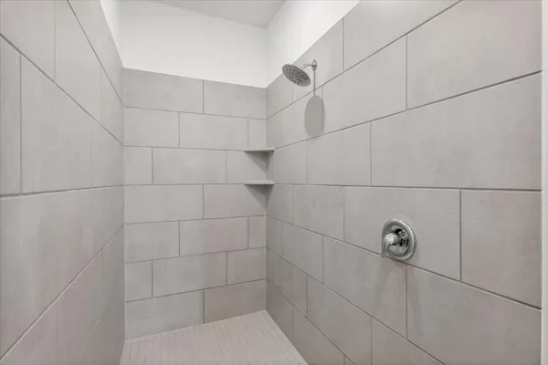 a bathroom with a double vanity sink and mirror