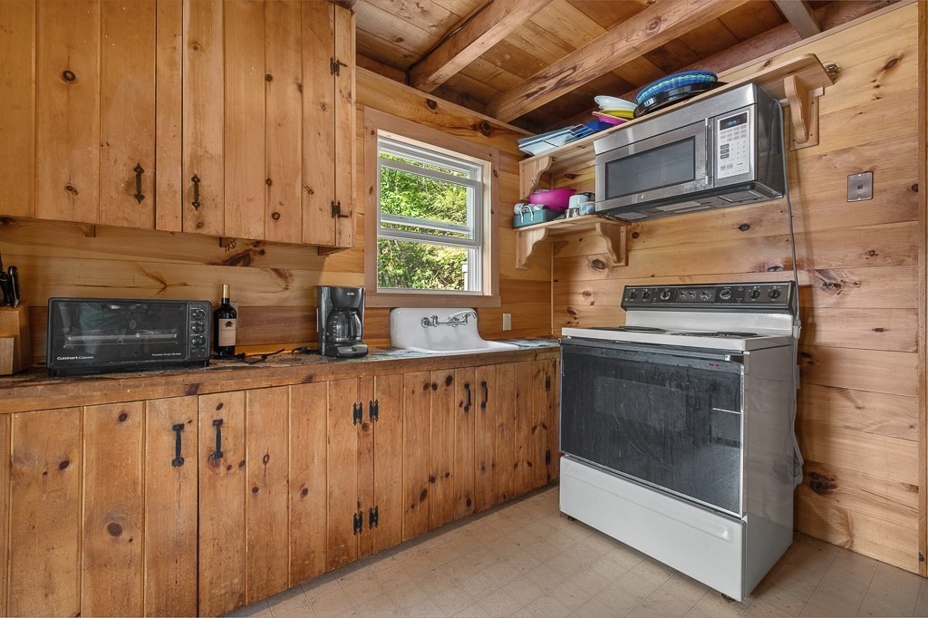 42 Goodrich Road Sturbridge, MA 01566 - Photo 11 of 36 a kitchen with stainless steel appliances granite countertop a stove and a sink