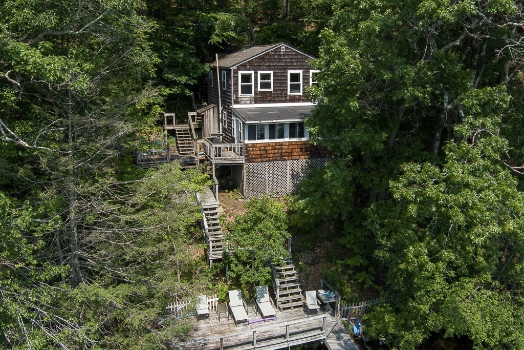 42 Goodrich Road Sturbridge, MA 01566 - Photo 17 of 36 a front view of a house with a yard and balcony