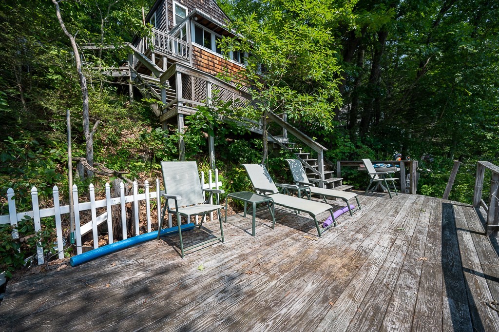 42 Goodrich Road Sturbridge, MA 01566 - Photo 33 of 36 a view of a patio with table and chairs and wooden fence