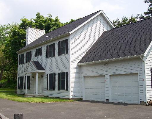 2693 Boston Post Road Darien, CT 06820 - Photo 1 of 1 a front view of a house with a yard and garage