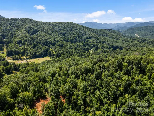 a view of a city with mountains in the background