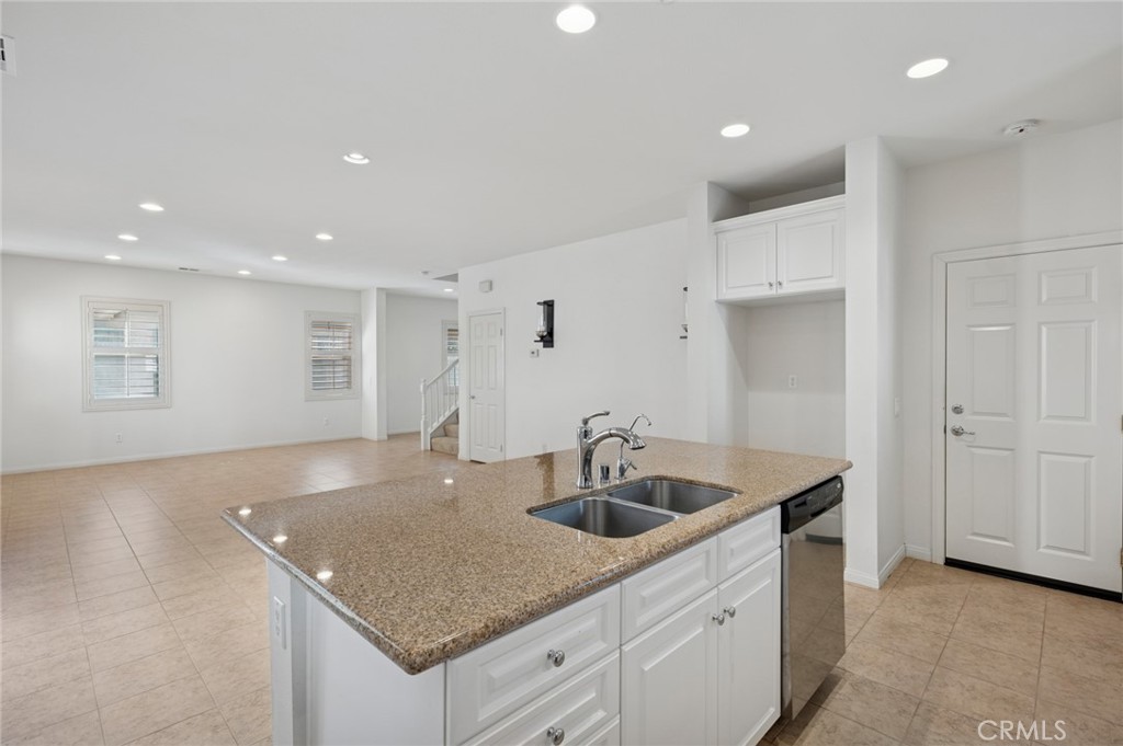 93 Keepsake Irvine, CA 92618 - Photo 12 of 25 a kitchen with sink and mirror
