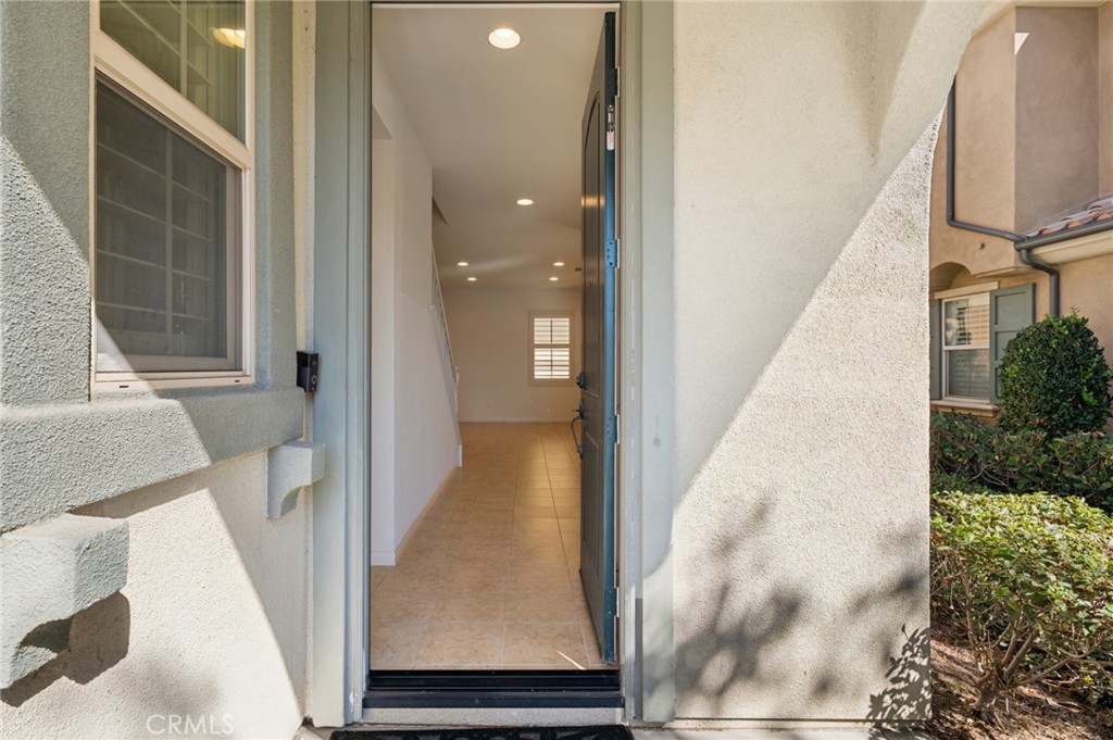 93 Keepsake Irvine, CA 92618 - Photo 3 of 25 a view of a living room with a white door and wooden floor