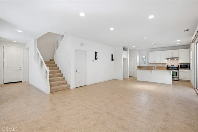 a view of a kitchen with furniture and a kitchen
