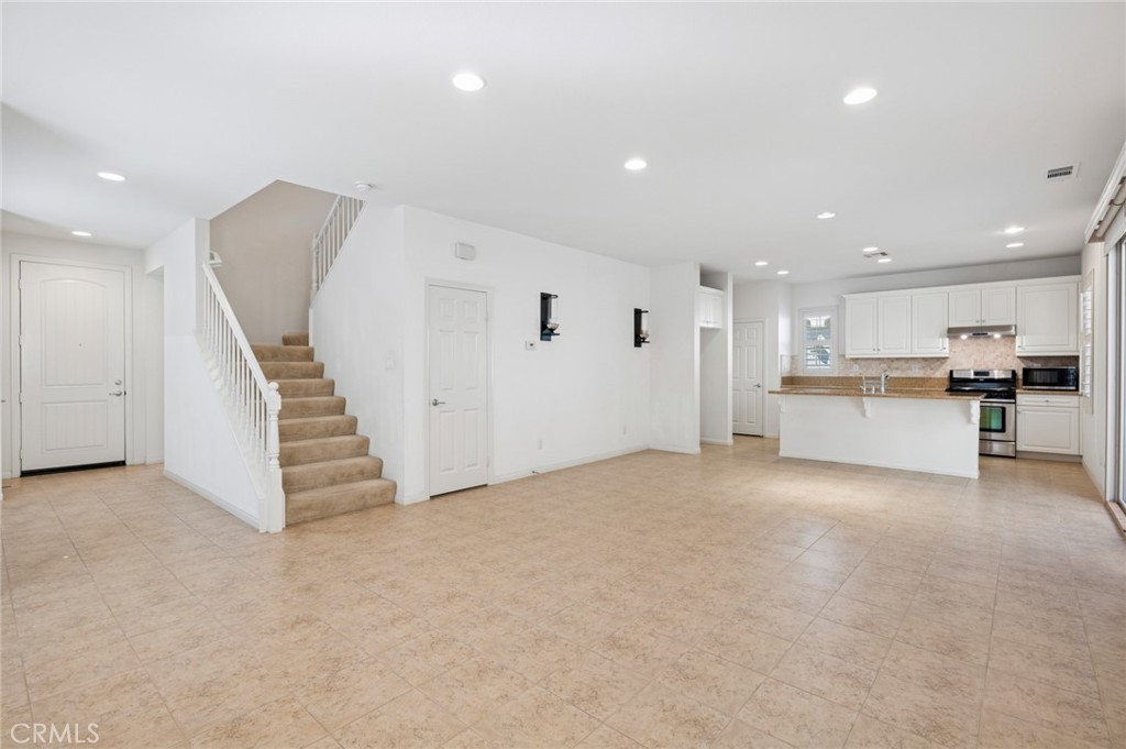 93 Keepsake Irvine, CA 92618 - Photo 5 of 25 a view of a kitchen with furniture and a kitchen