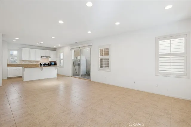 a view of a kitchen with a sink and cabinets