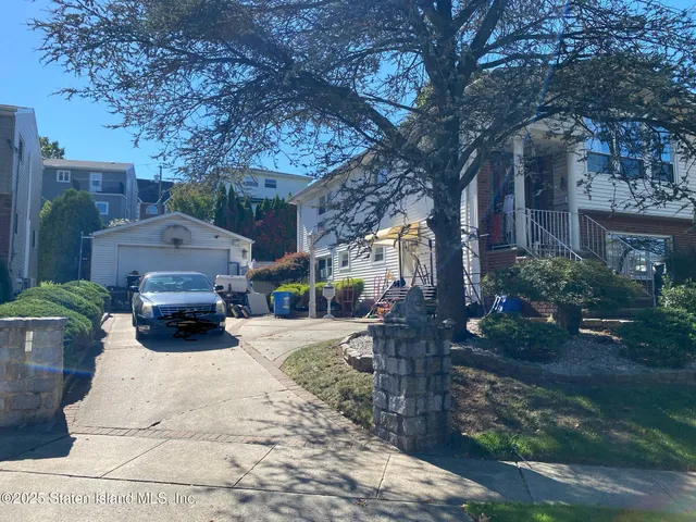 a car parked in front of a brick house