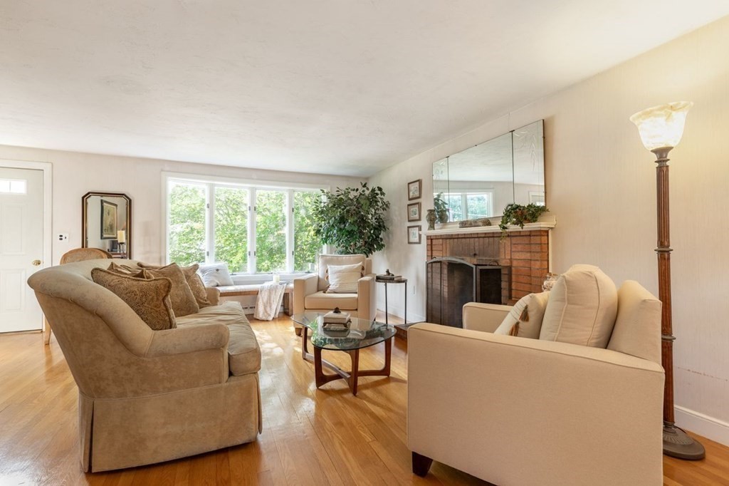 117 Prospect Street Canton, MA 02021 - Photo 3 of 30 a living room with furniture a fireplace and a large window
