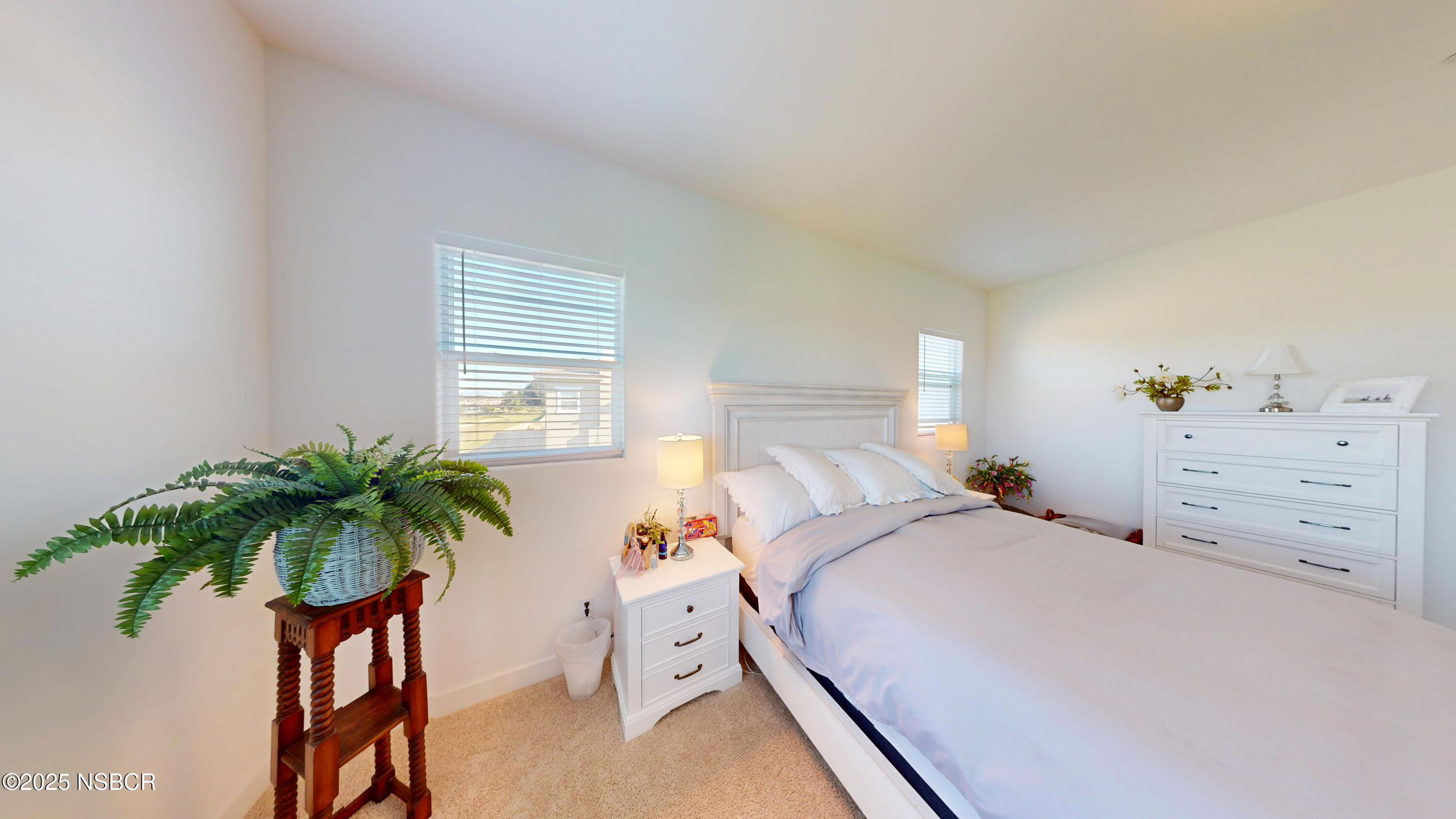 813 Skyview Lane Santa Maria, CA 93455 - Photo 22 of 49 a bedroom with a bed and a potted plant
