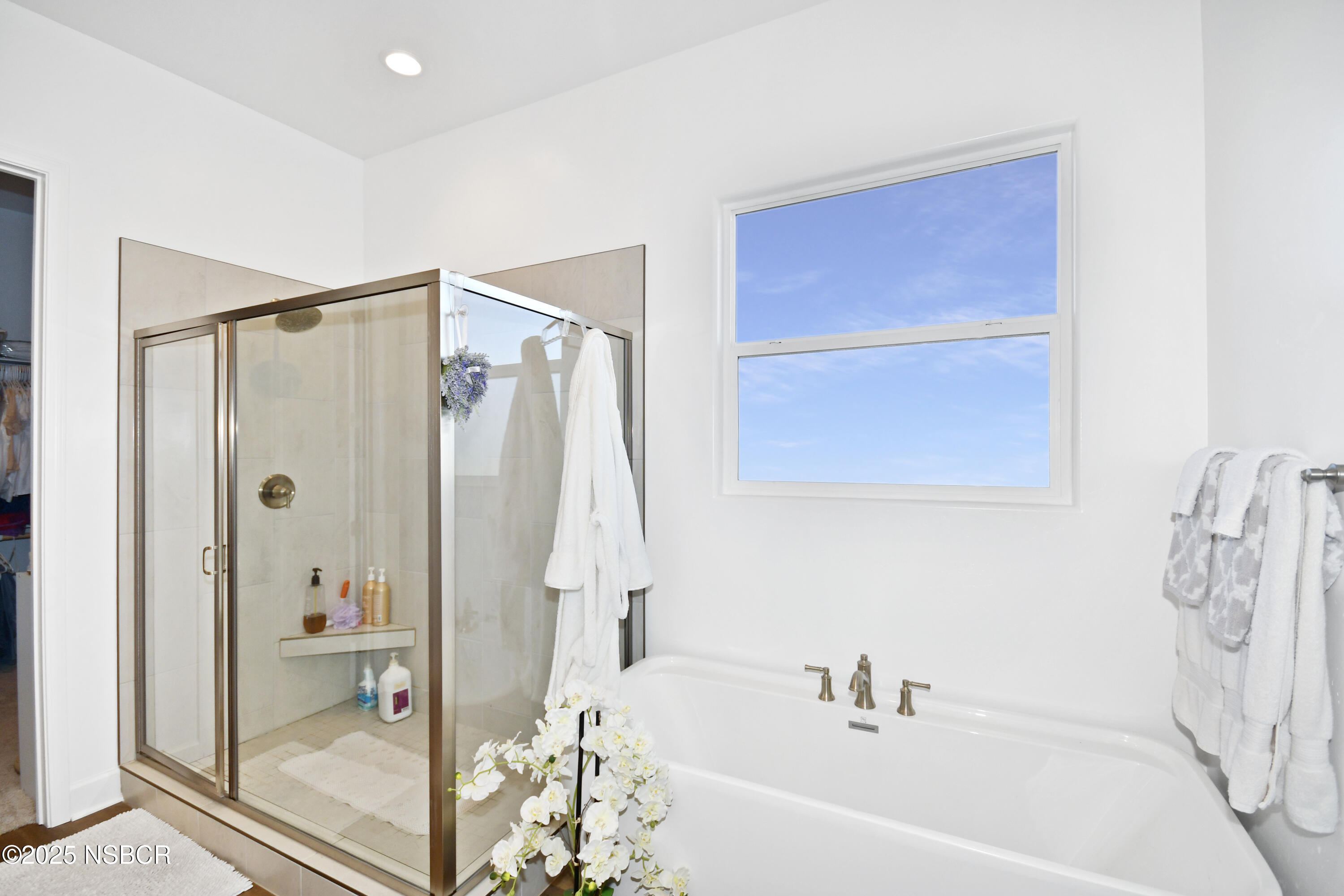 813 Skyview Lane Santa Maria, CA 93455 - Photo 24 of 49 a bathroom with a bathtub and a shower