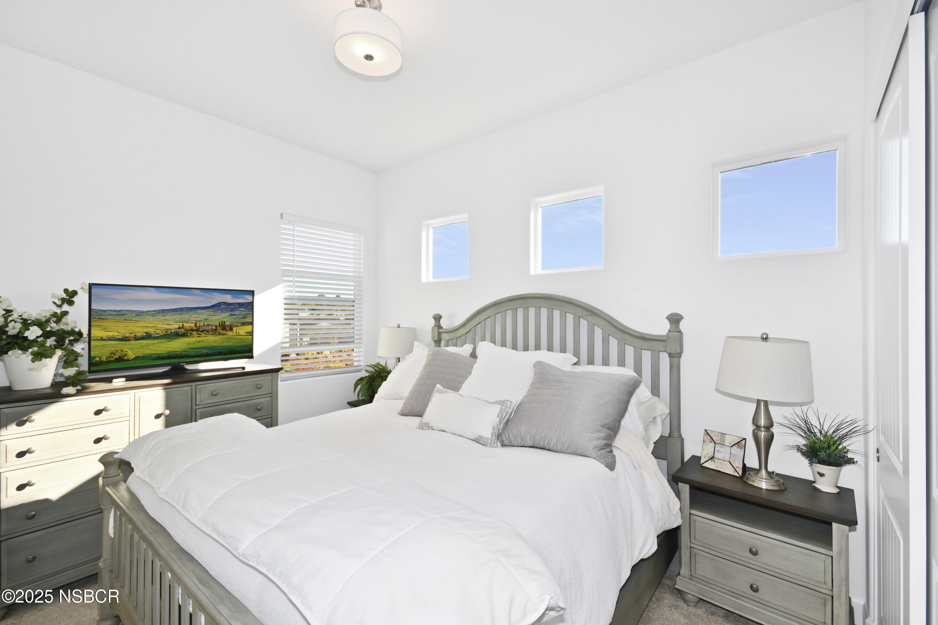 813 Skyview Lane Santa Maria, CA 93455 - Photo 31 of 49 a bedroom with a bed and a flat screen tv