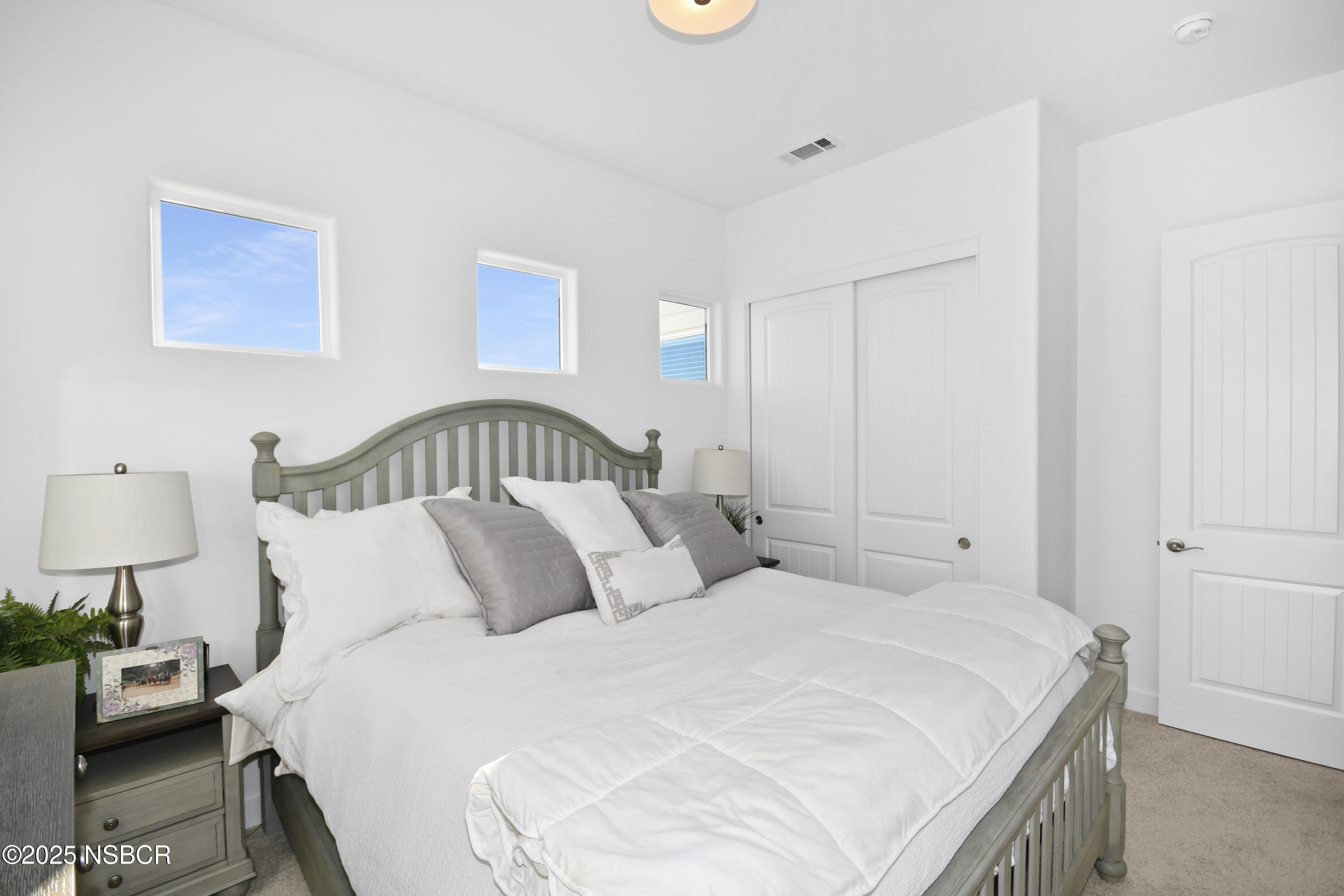 813 Skyview Lane Santa Maria, CA 93455 - Photo 32 of 49 a bedroom with a bed and a lamp