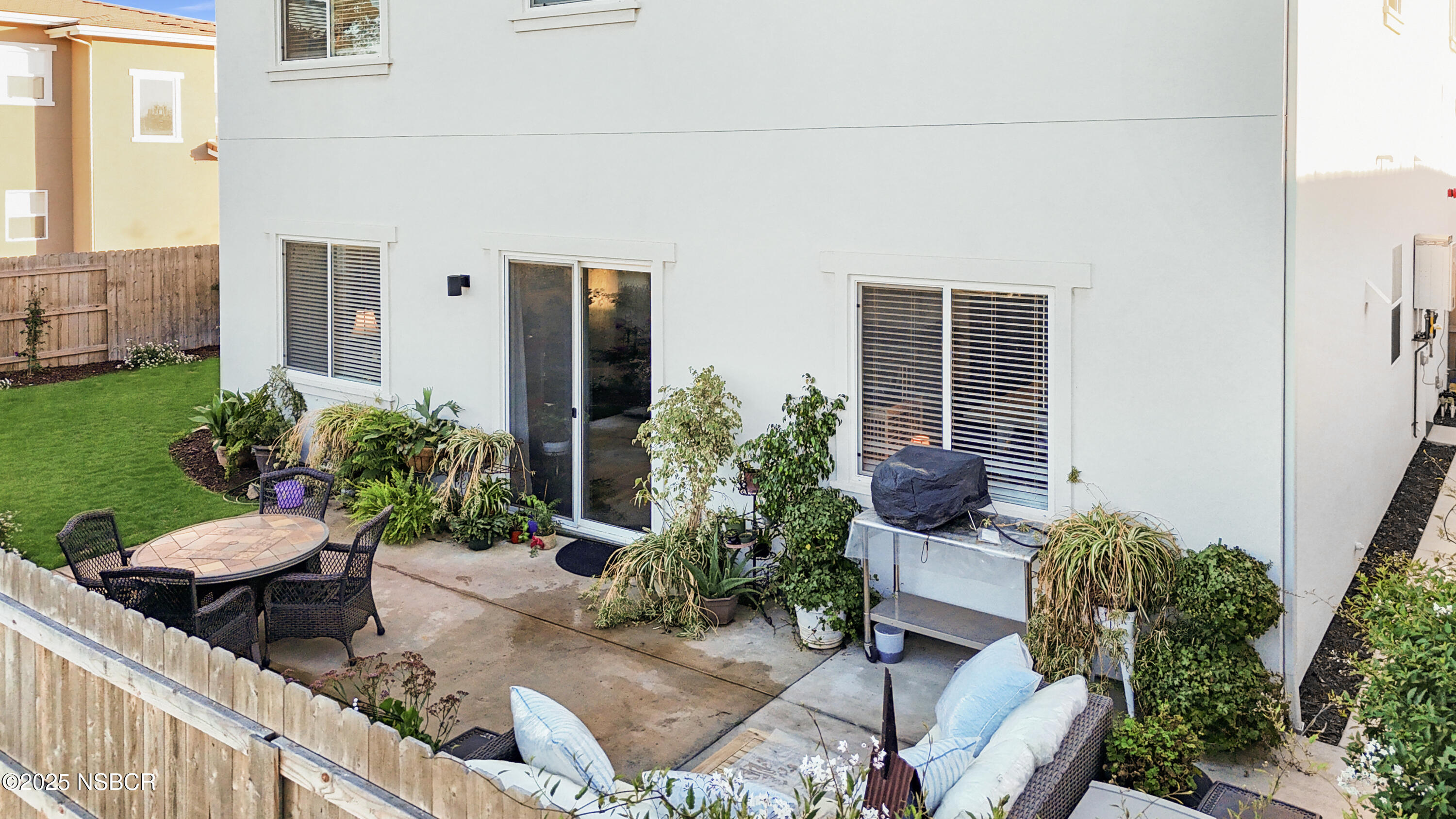 813 Skyview Lane Santa Maria, CA 93455 - Photo 36 of 49 a view of a chair and table in backyard