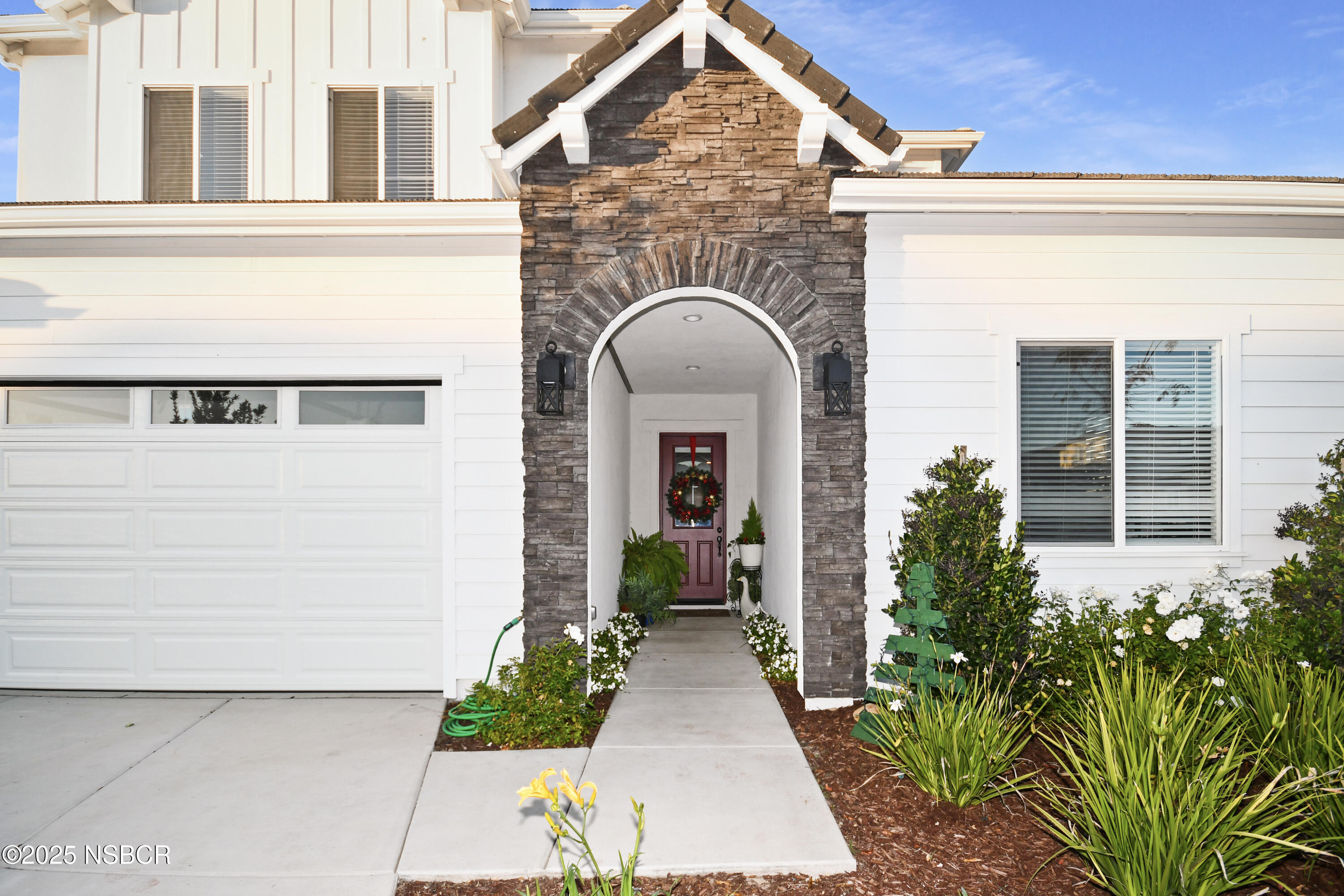 813 Skyview Lane Santa Maria, CA 93455 - Photo 5 of 49 a view of a brick house with potted plants