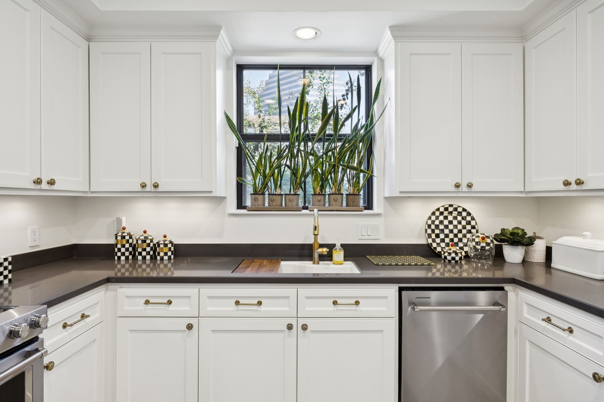 4964 Post Oak Timber Drive Houston, TX 77056 - Photo 19 of 48 Beautifully updated kitchen featuring brand-new appliances, sleek quartz countertops, and abundant custom cabinetry offering both style and functionality.