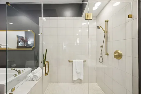 a bathroom with a tub and shower