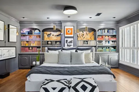 a living room with fireplace furniture and a large window