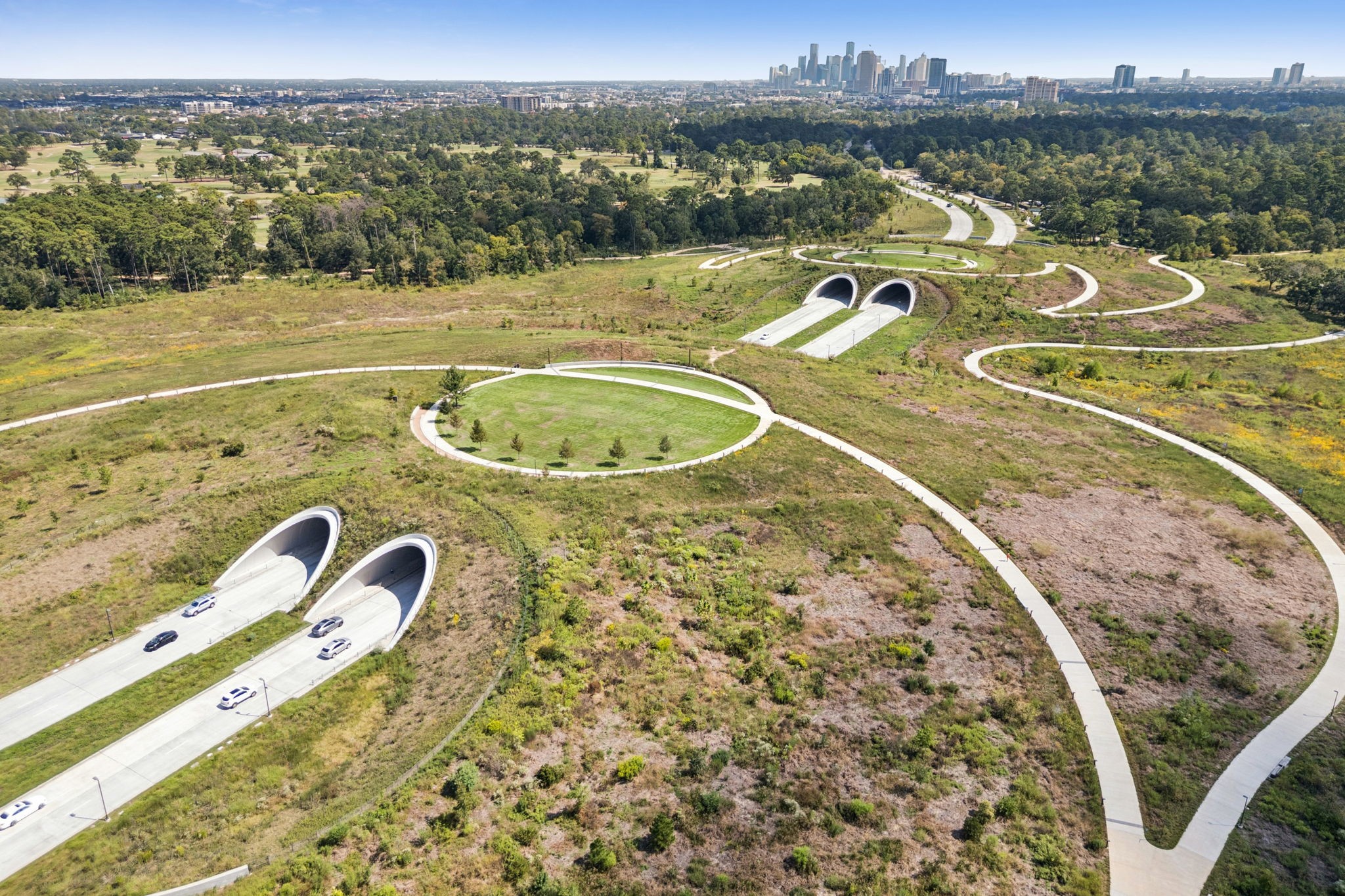 4964 Post Oak Timber Drive Houston, TX 77056 - Photo 41 of 48 The Kinder Land Bridge is a stunning architectural and environmental landmark within Memorial Park, designed to seamlessly connect the north and south sides of the park while restoring the natural landscape.