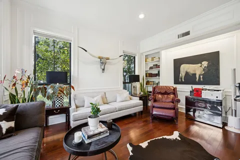 a living room with furniture or couch and a flat screen tv