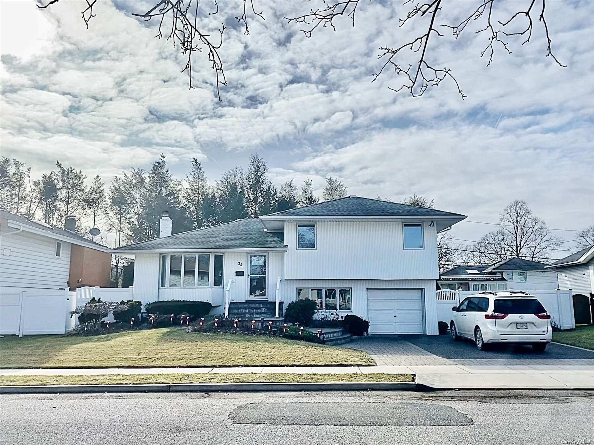 a view of a car parked in front of house