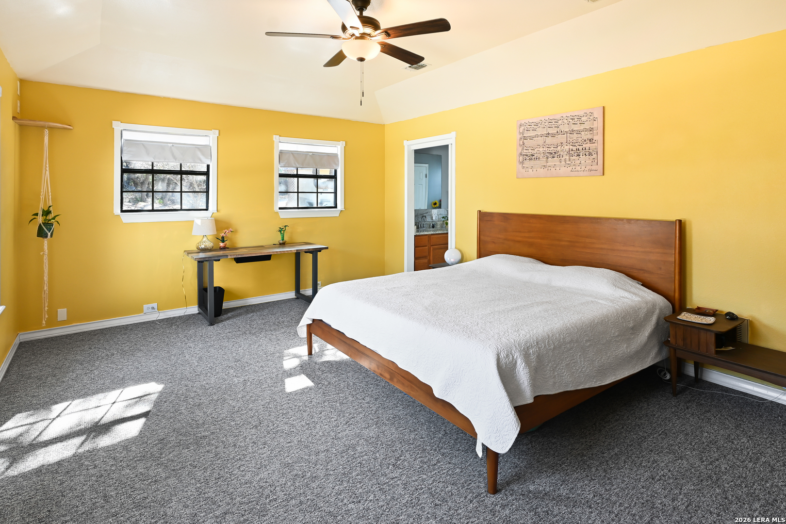 713 Lake Forest Road Pipe Creek, TX 78063 - Photo 14 of 65 a bedroom with a bed and table