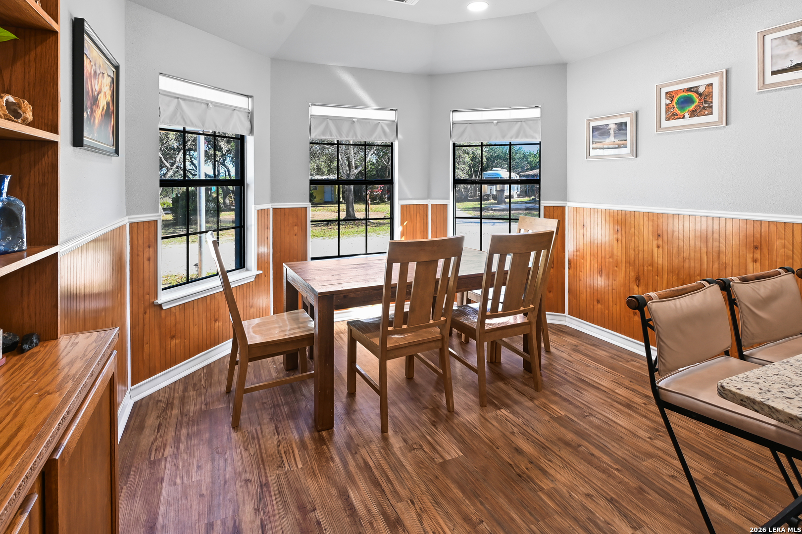 713 Lake Forest Road Pipe Creek, TX 78063 - Photo 21 of 65 a view of a dining room with furniture window and wooden floor