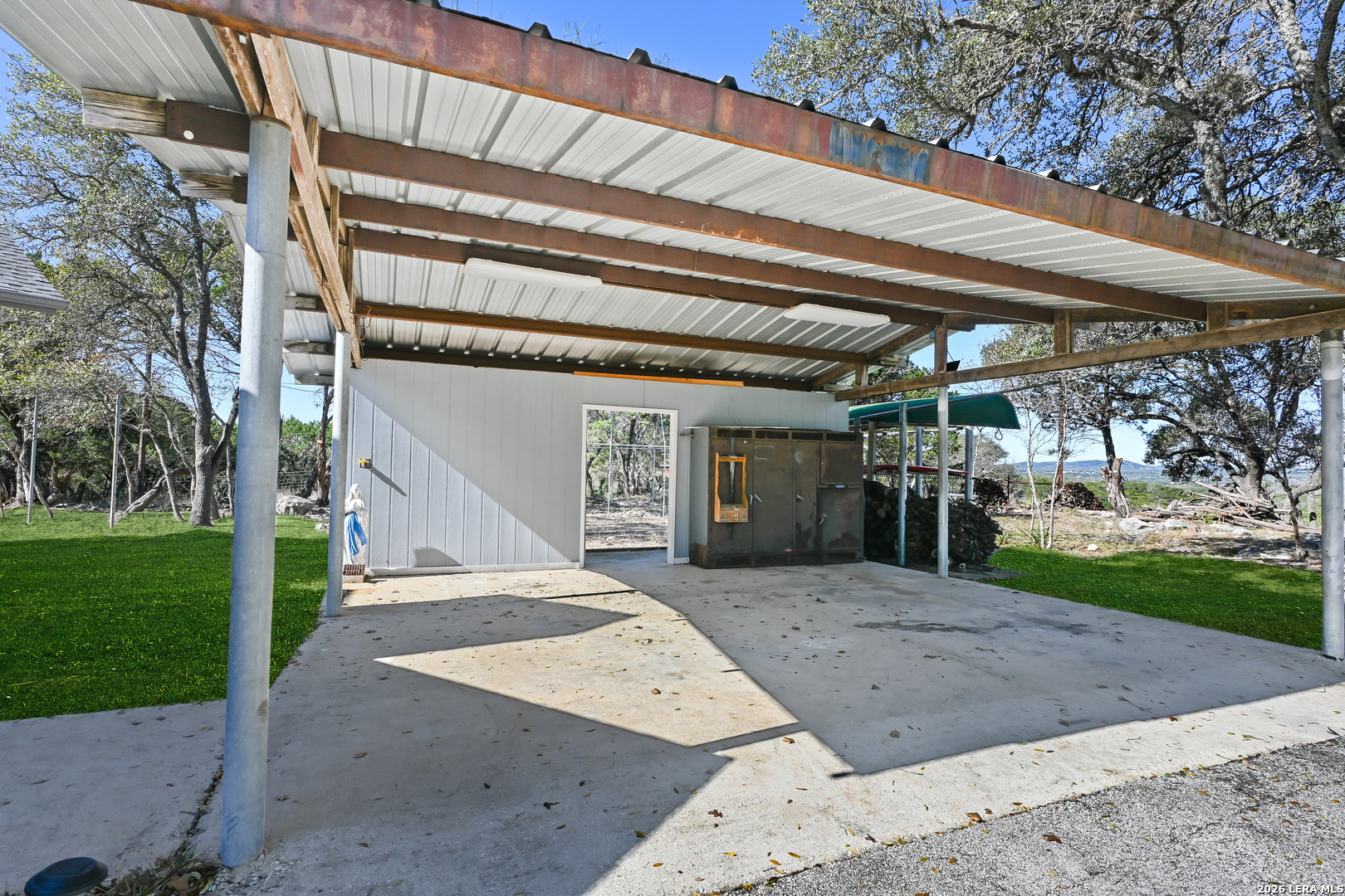 713 Lake Forest Road Pipe Creek, TX 78063 - Photo 29 of 65 a view of a house with a outdoor space