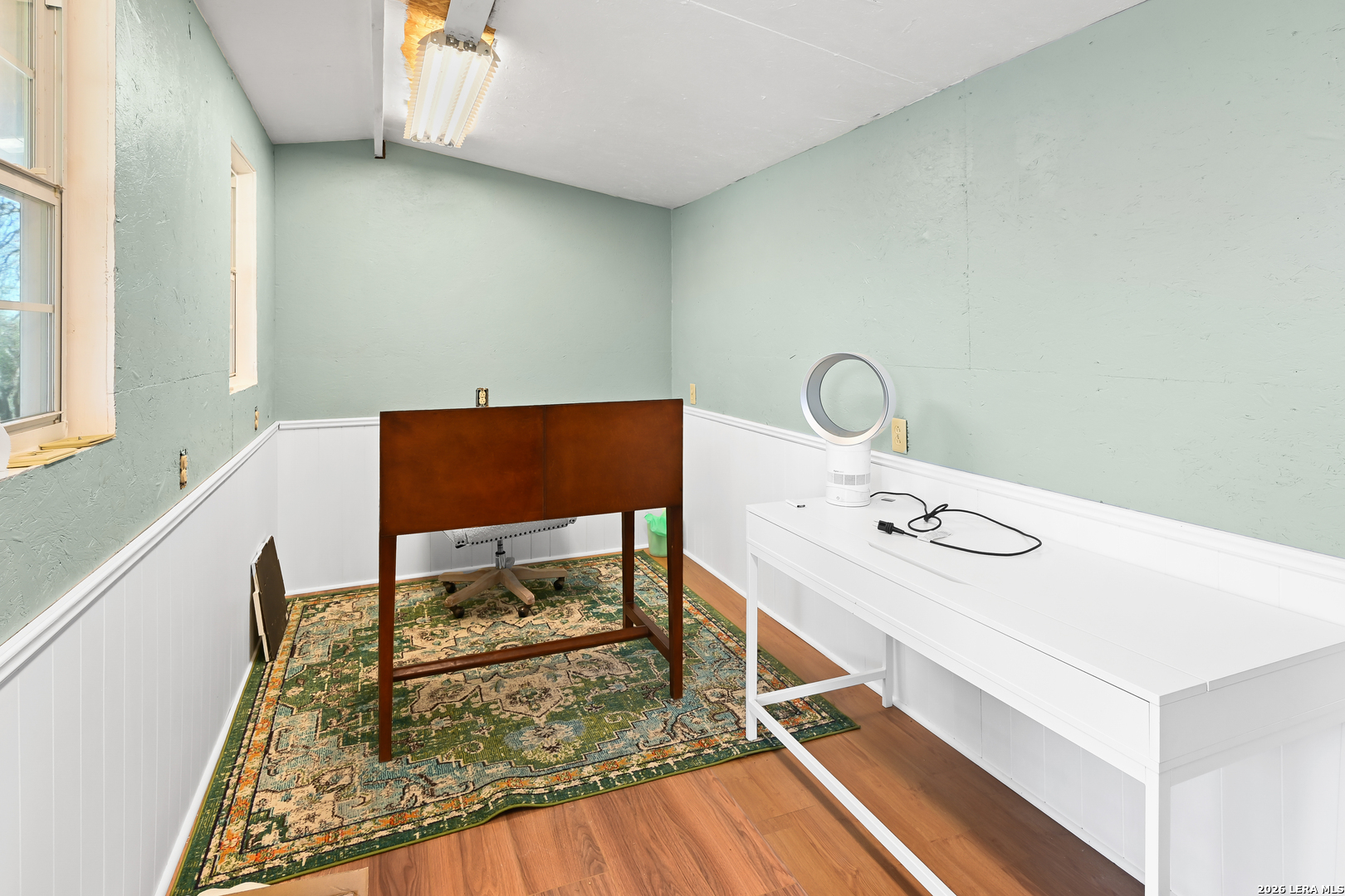 713 Lake Forest Road Pipe Creek, TX 78063 - Photo 34 of 65 a living room with table chairs and a stove