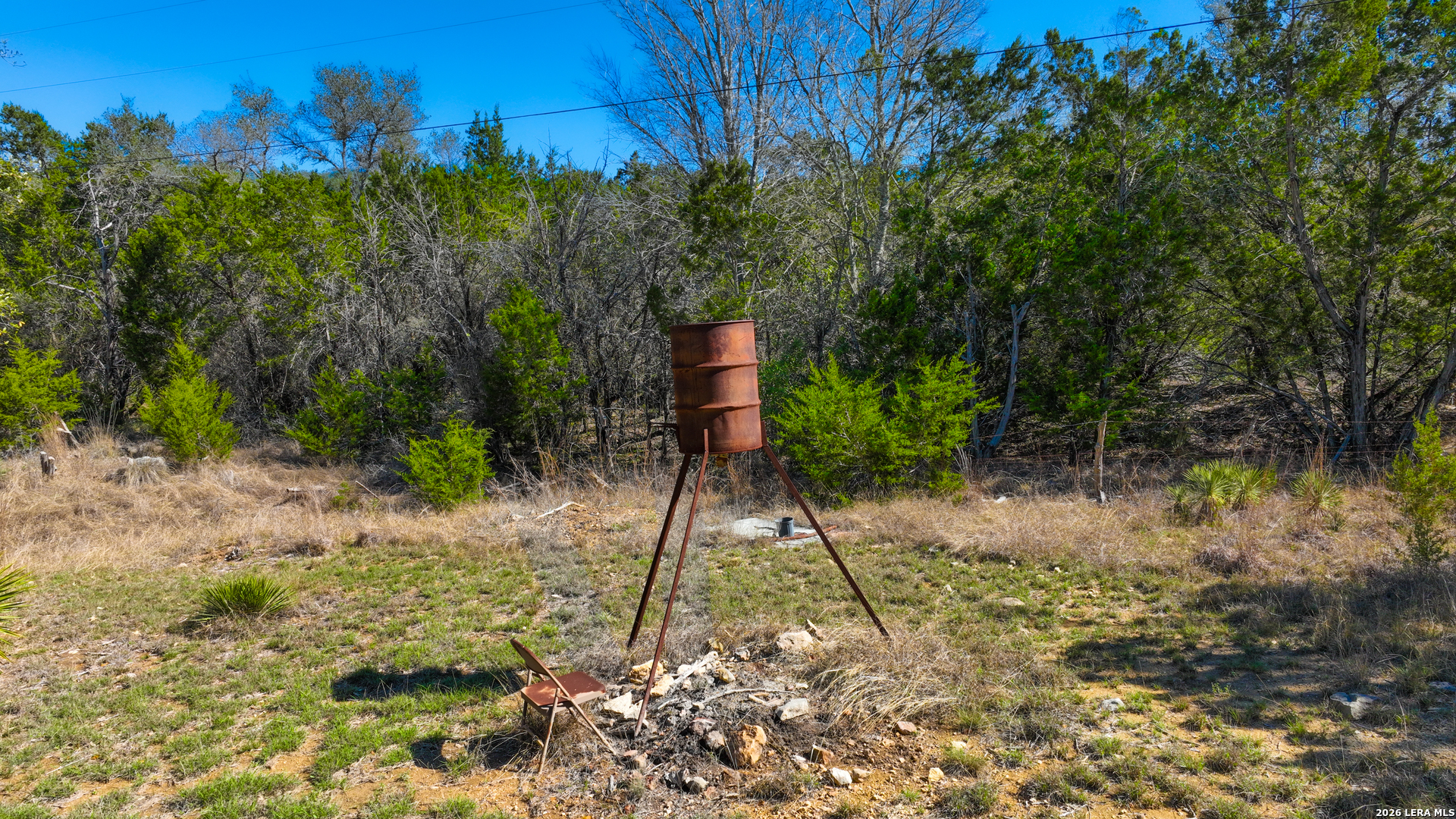 713 Lake Forest Road Pipe Creek, TX 78063 - Photo 36 of 65 a backyard of a house with lots of green space