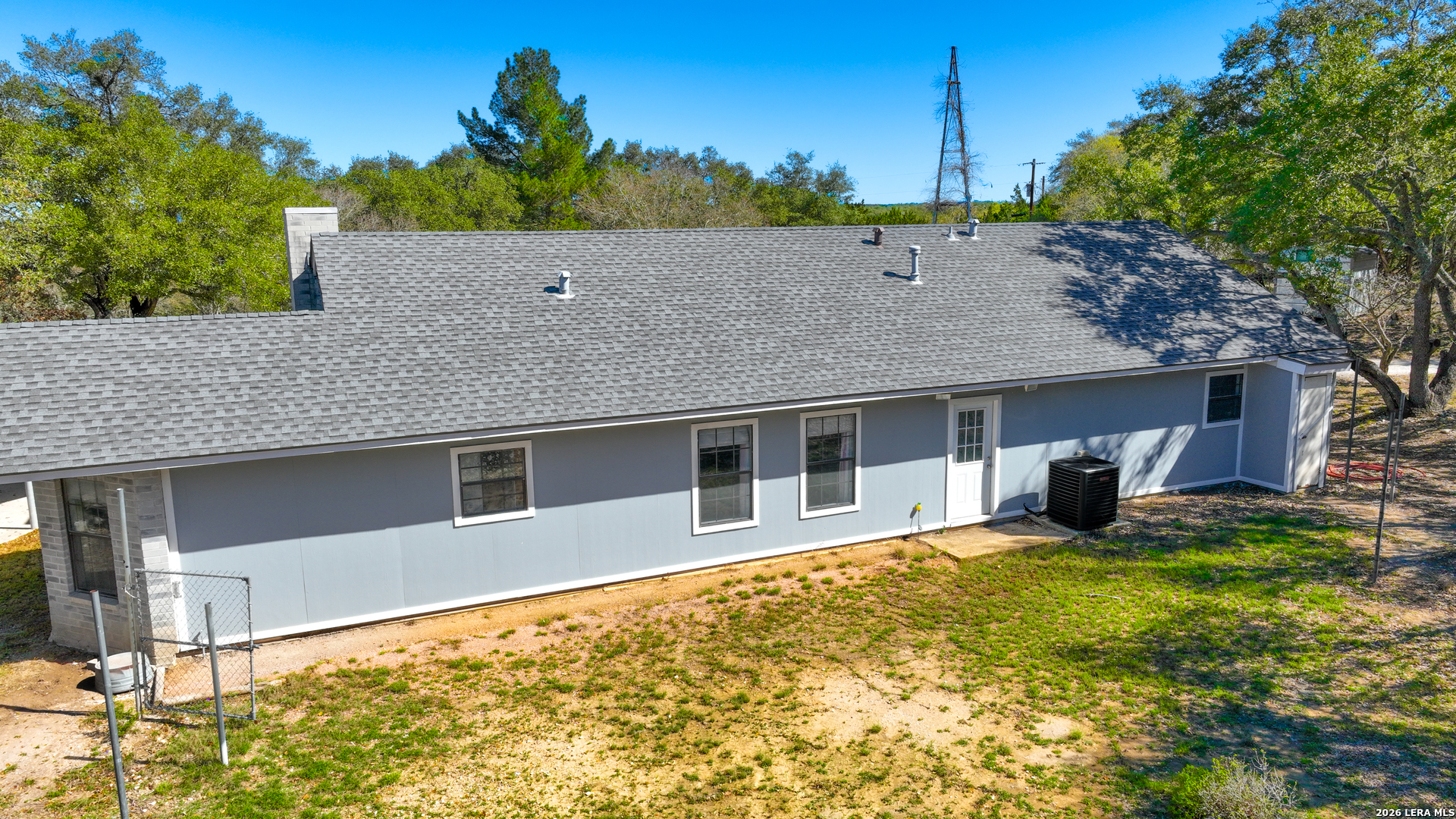 713 Lake Forest Road Pipe Creek, TX 78063 - Photo 4 of 65 a house view with a garden space