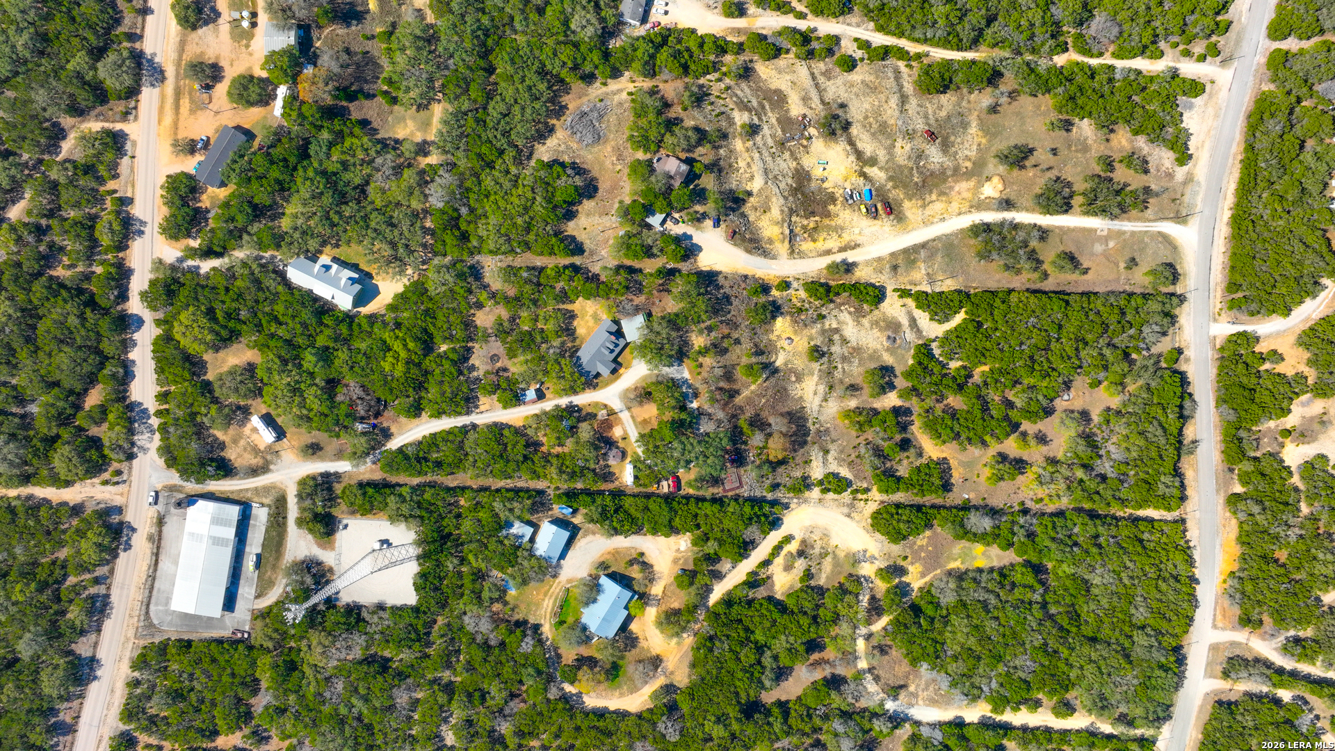713 Lake Forest Road Pipe Creek, TX 78063 - Photo 45 of 65 a backyard of a house with lots of green space