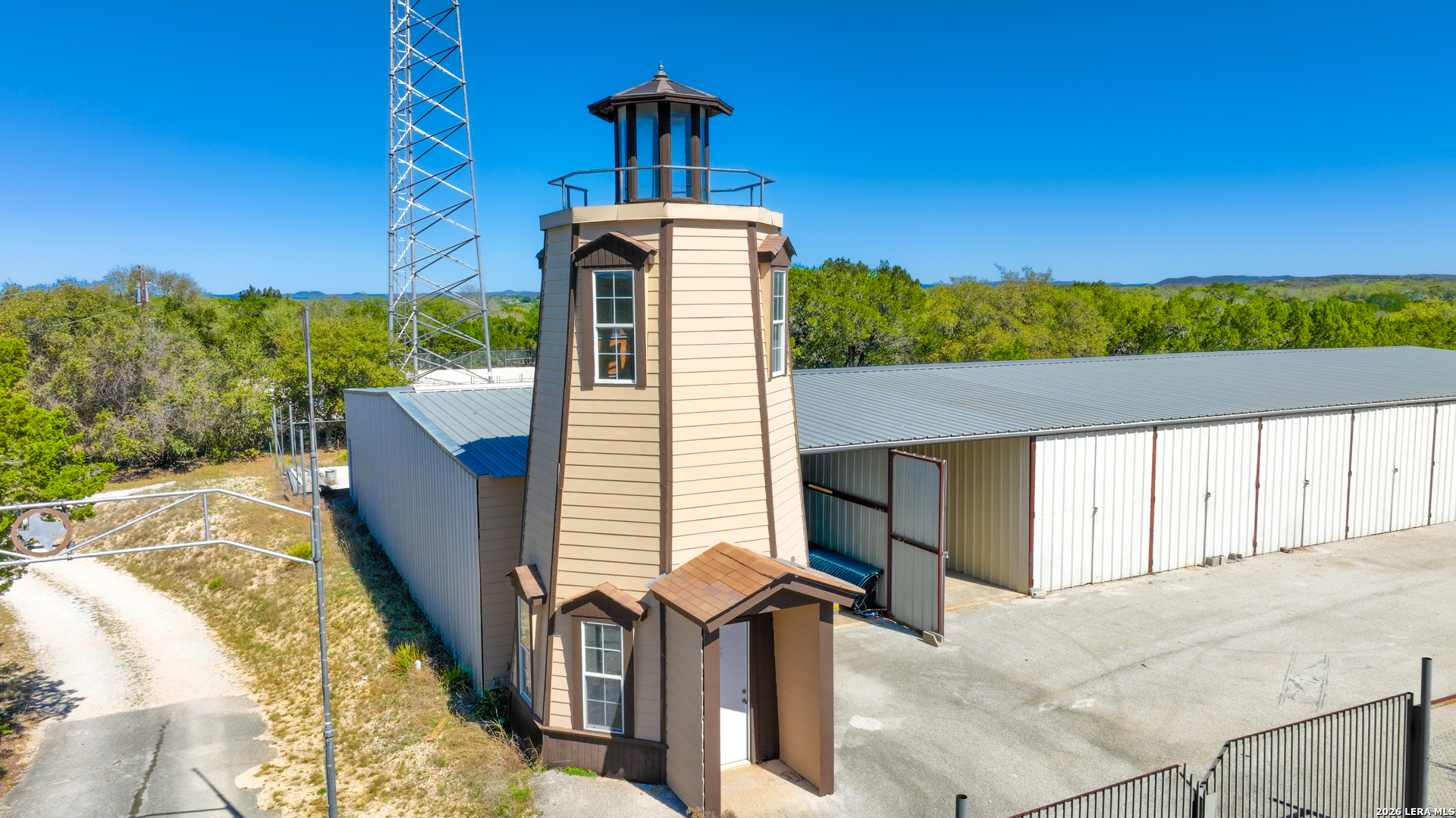 713 Lake Forest Road Pipe Creek, TX 78063 - Photo 46 of 65 a front view of a house with a yard
