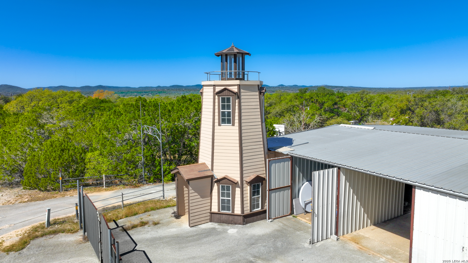 713 Lake Forest Road Pipe Creek, TX 78063 - Photo 49 of 65 a view of a patio with a table chairs and a table