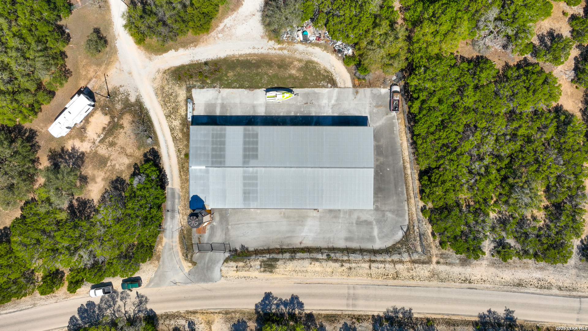 713 Lake Forest Road Pipe Creek, TX 78063 - Photo 55 of 65 front view of a house with a yard