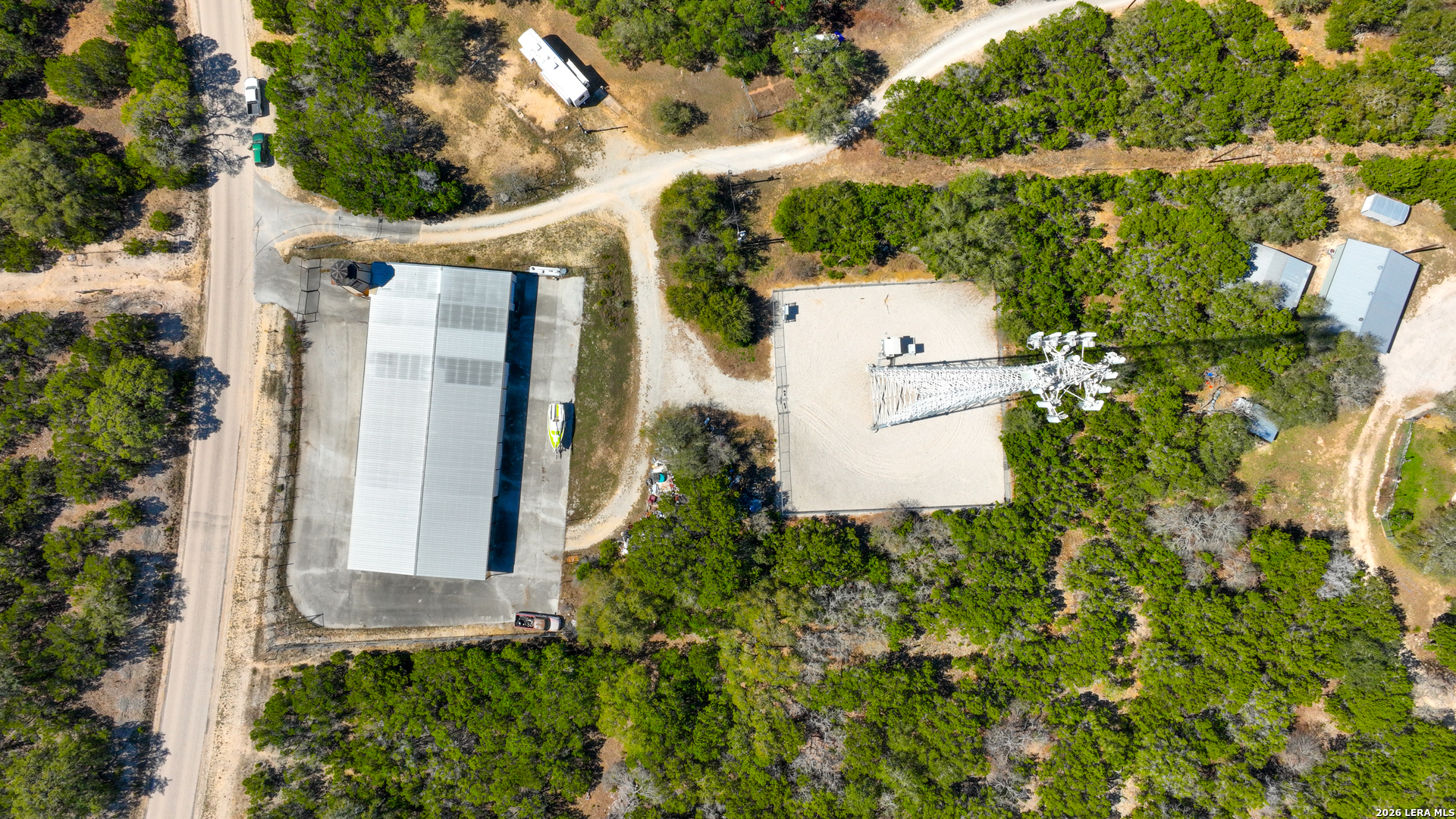 713 Lake Forest Road Pipe Creek, TX 78063 - Photo 56 of 65 an aerial view of a house with a yard