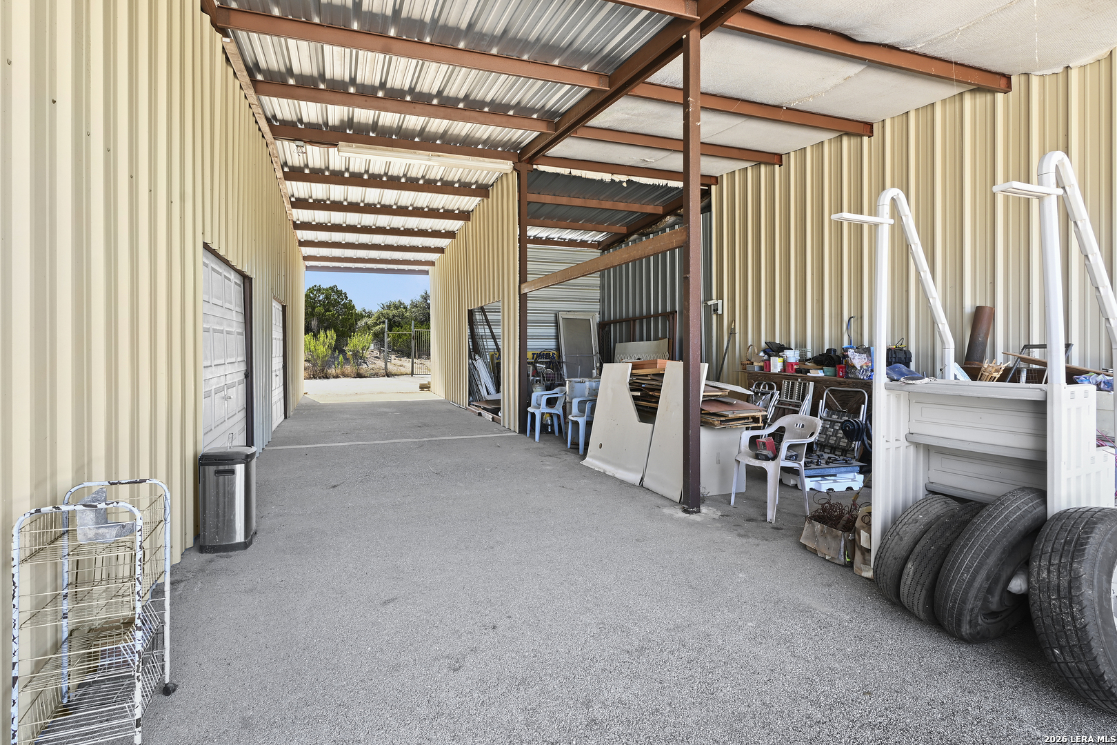 713 Lake Forest Road Pipe Creek, TX 78063 - Photo 59 of 65 a view of livingroom with furniture and floor to ceiling window