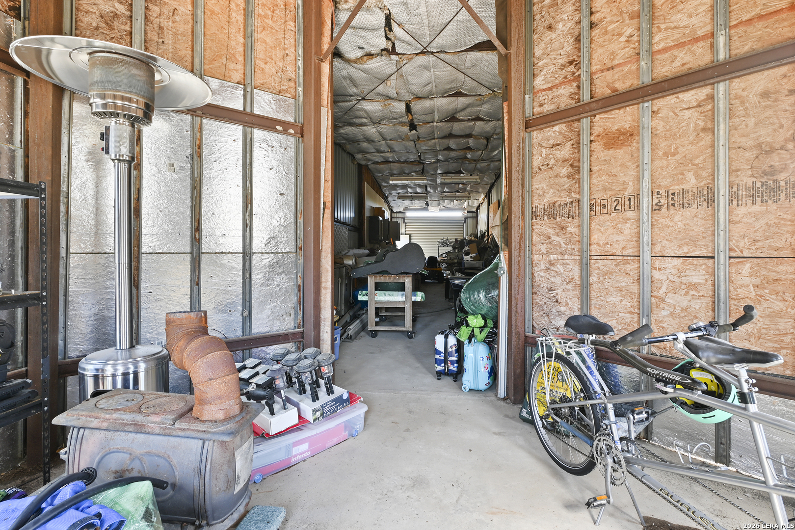 713 Lake Forest Road Pipe Creek, TX 78063 - Photo 63 of 65 a living room with furniture and floor to ceiling windows