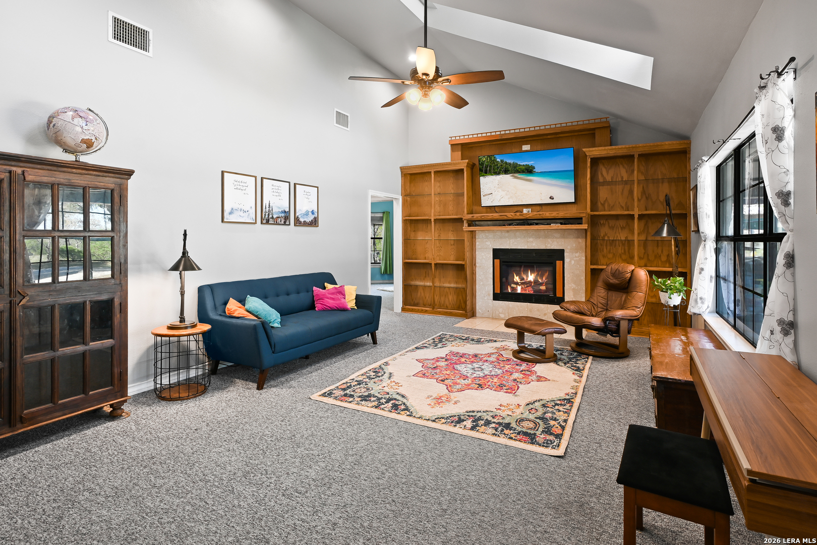 713 Lake Forest Road Pipe Creek, TX 78063 - Photo 8 of 65 a living room with furniture fireplace and flat screen tv